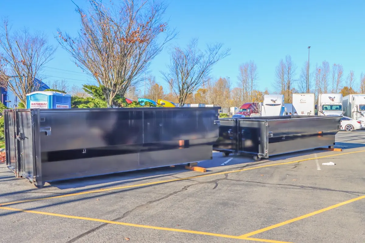 Professional dumpster rental service with roll-off container on residential driveway in Sugarmill Woods